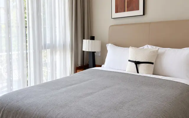 Private bedroom with a double bed and garden window