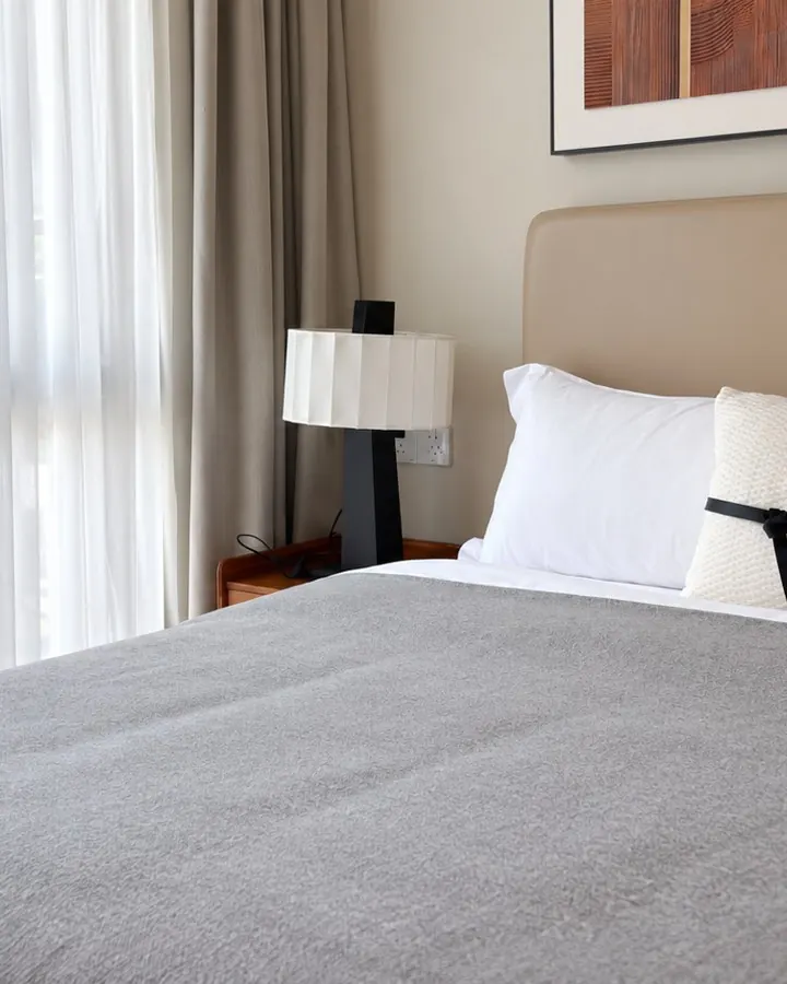 Private bedroom with a double bed and garden window