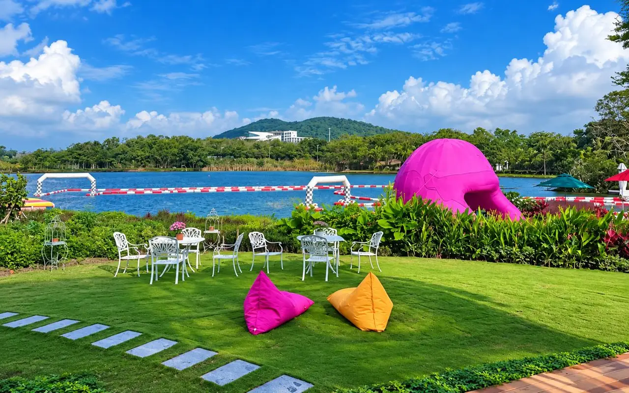 Lakeside lawn with tables and bean bags