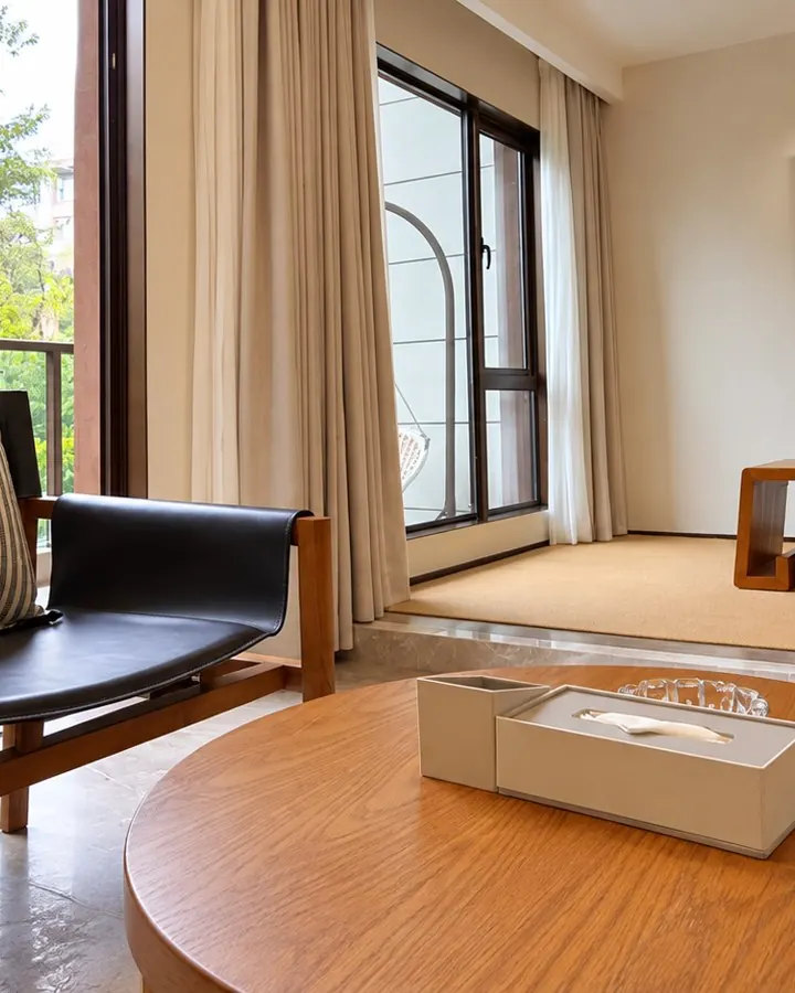 Loft sitting corner with armchair, low table and floor cushions